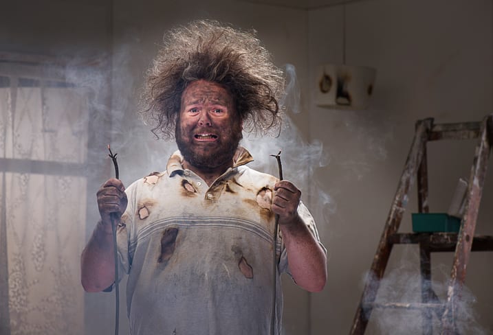 Palmetto Electrical Contractors | man with blackened face and frizzed out hair suffering a shock trying to do his own electrical work