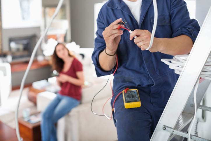 Palmetto Electrical Contractors | electrician working in a living room