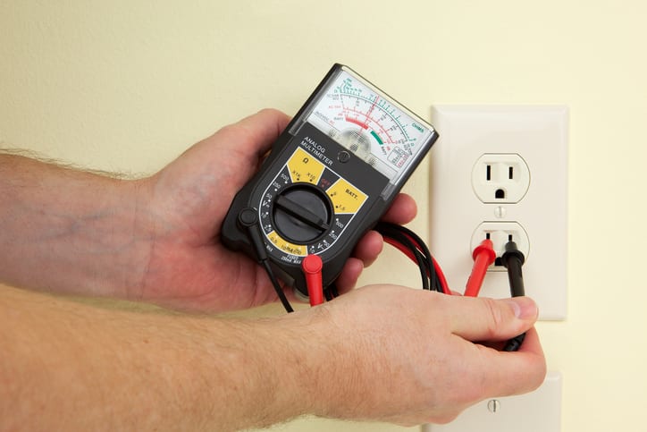 Palmetto Electrical Contractors | close up of an electrician testing a circuit