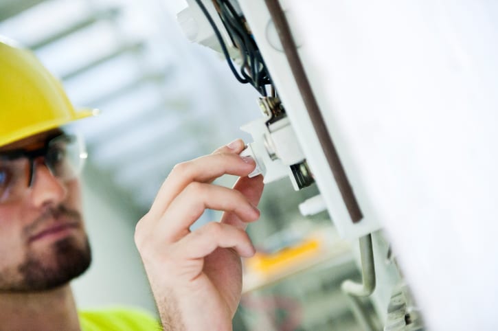 Palmetto Electrical Contractors | technician changing out an old fuse box
