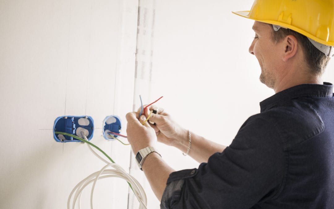 Palmetto Electrical Contractors | electrician working with wires
