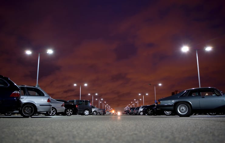 Palmetto Electrical Contractors | cars parked in a parking lot at night with the lights lit up
